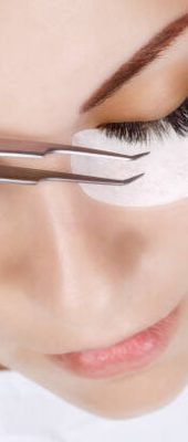 Eyelash Extension Procedure. Woman Eye with Long Eyelashes. Lashes. Close up, macro, selective focus